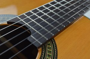 Image of Giuliani CL-6 Classical Guitar fingerboard, strings, and sound hole.